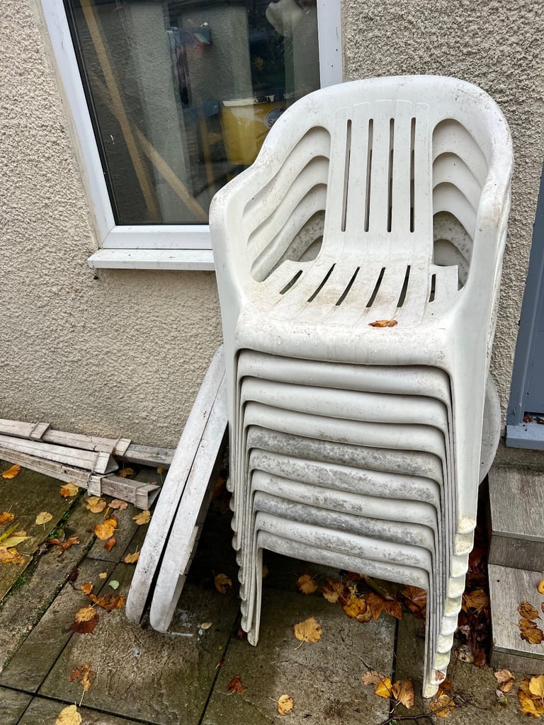 10 plastic stacking chairs and 3 tables