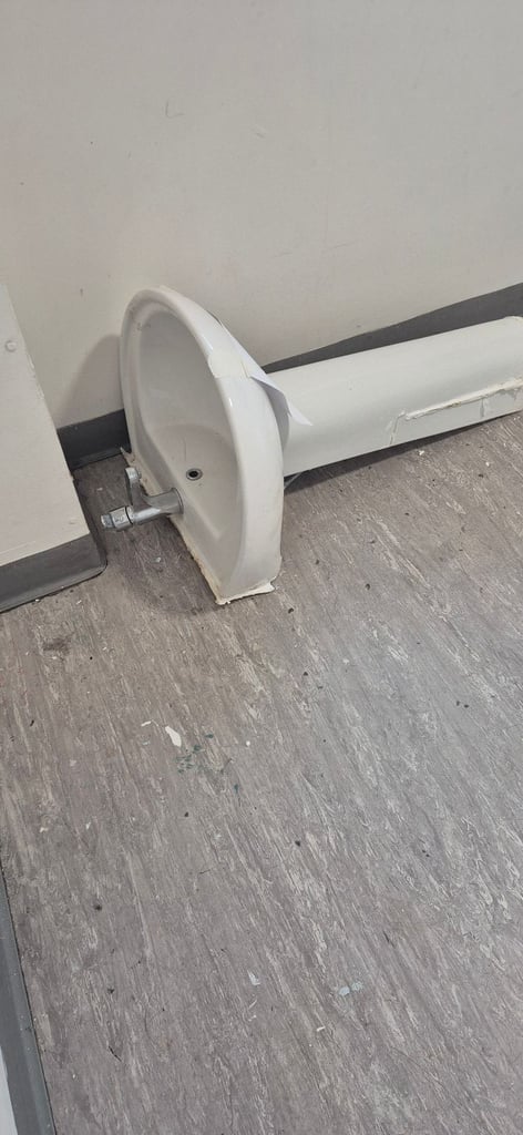 Basin with mixer tap .