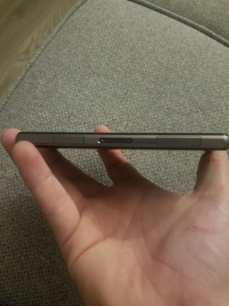 Black sony mobile with charger
