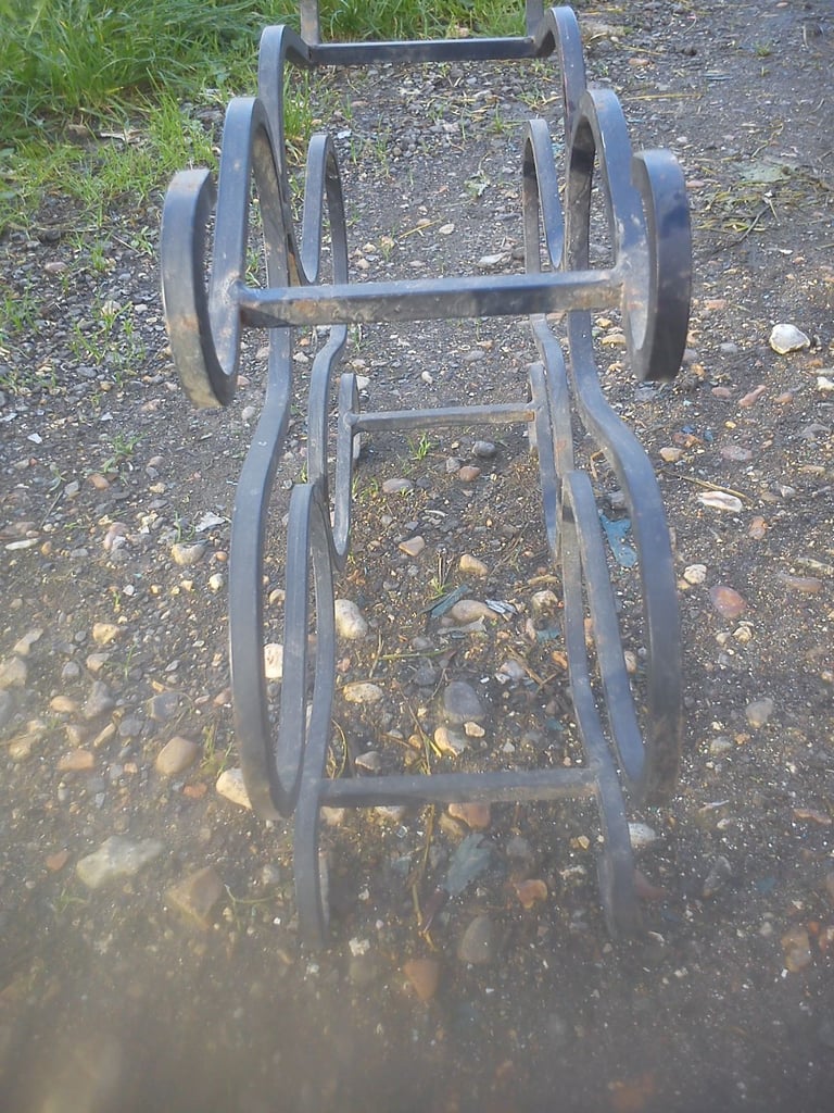 Vintage forged steel wine rack.