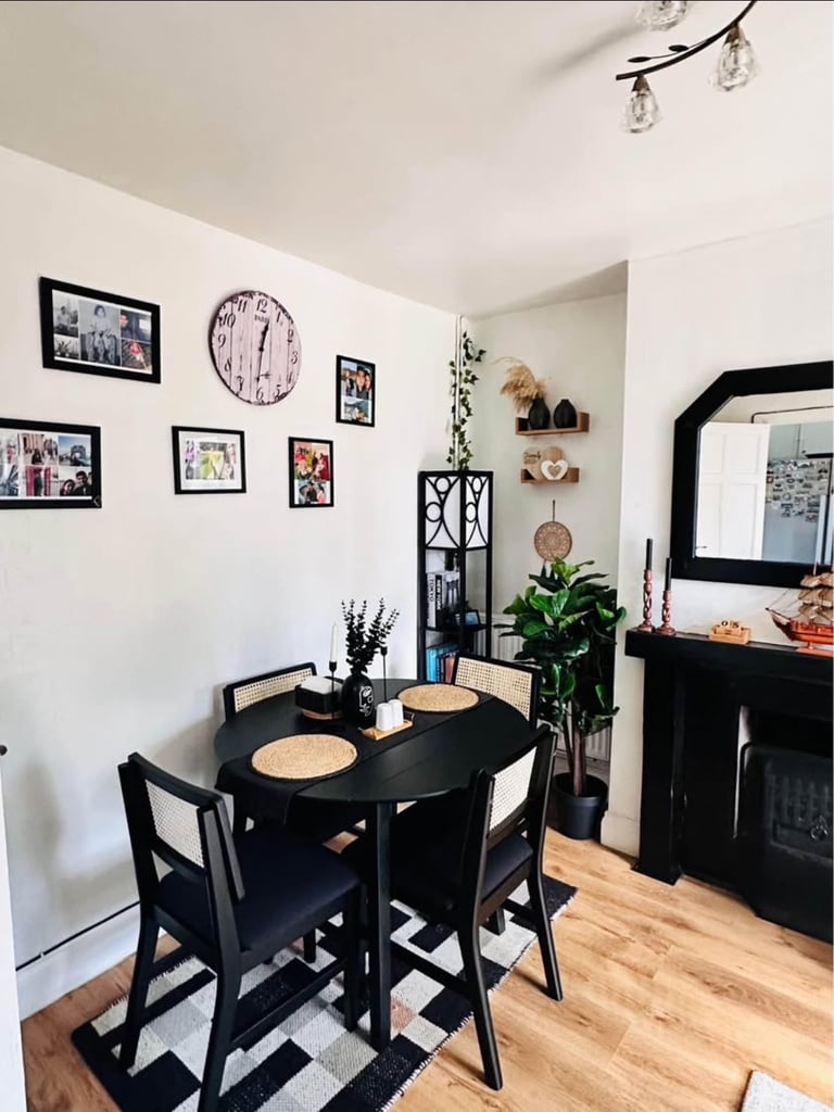 image for Lowering the price as needed a space.Black table and 4 chairs from Laura and James. never been used.