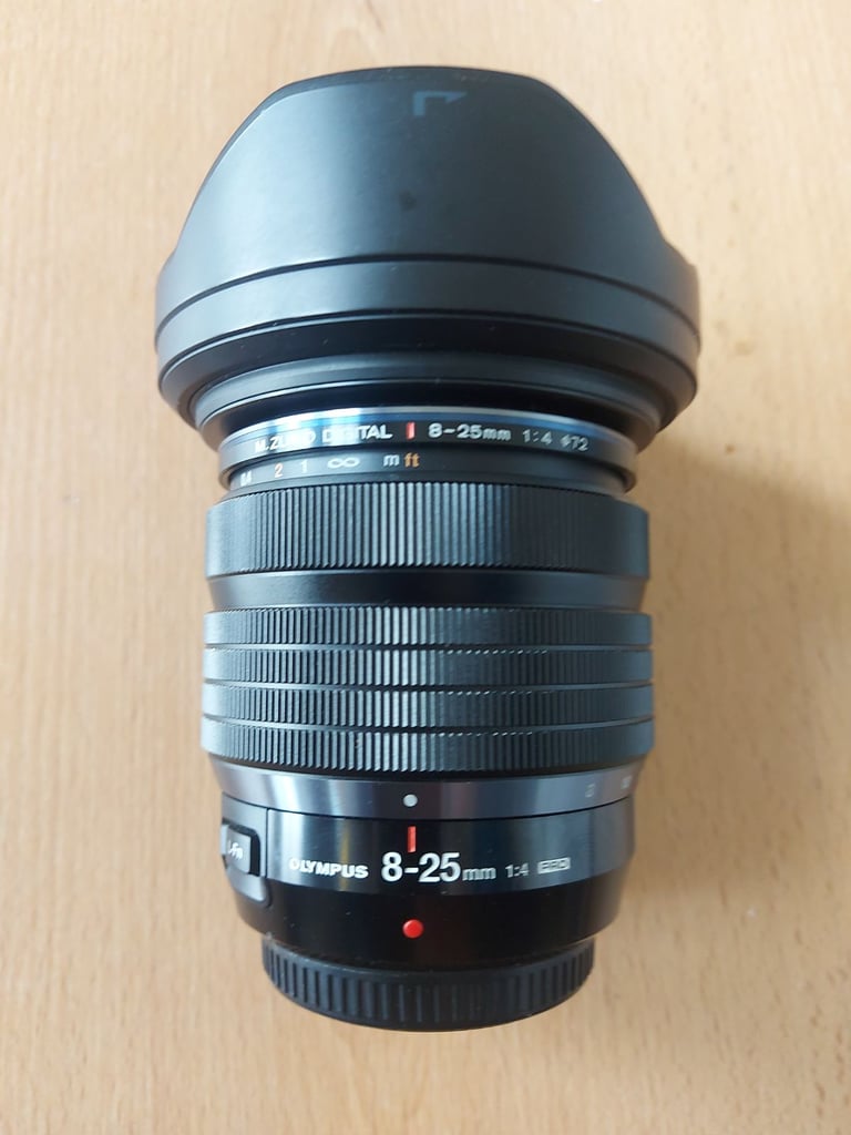 Pro Olympus lenses £550 each or both for £1000
