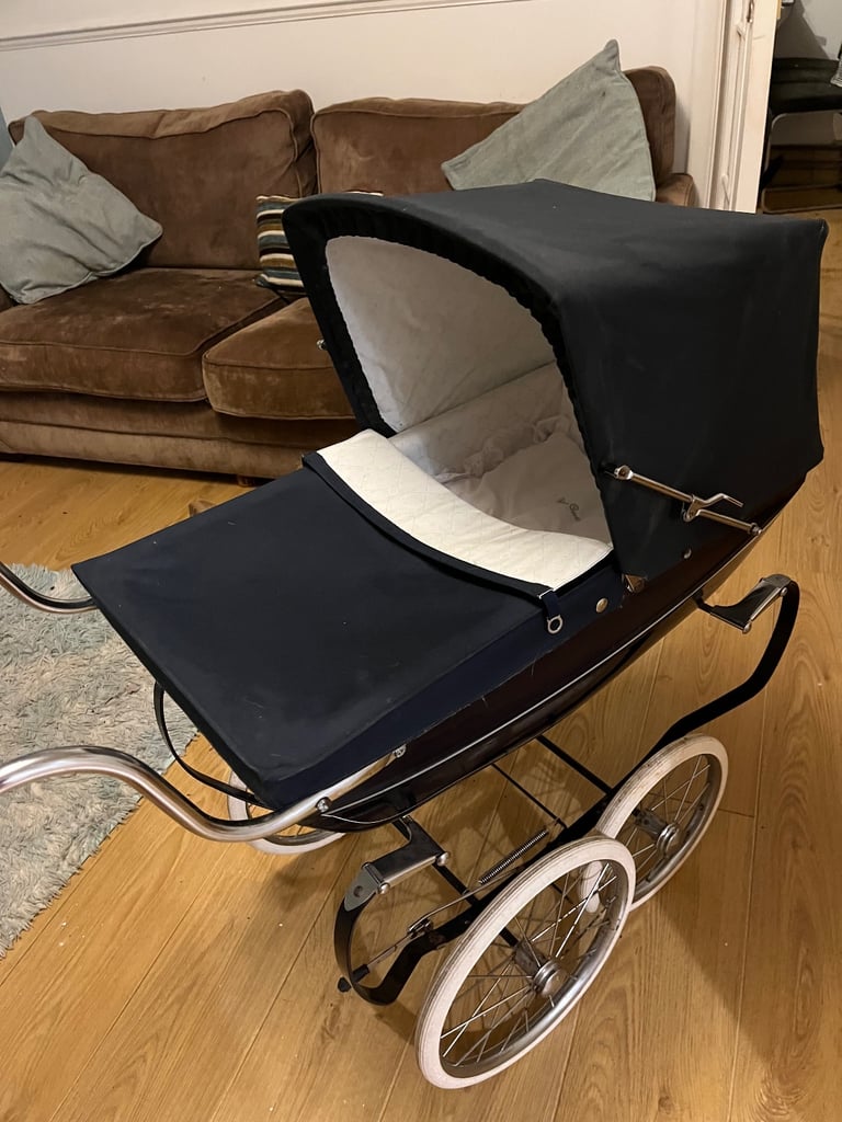 Children’s silver cross pram