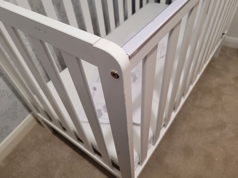 Hardly used Adjustable Cot/bed with Mattress 120 x 60cm