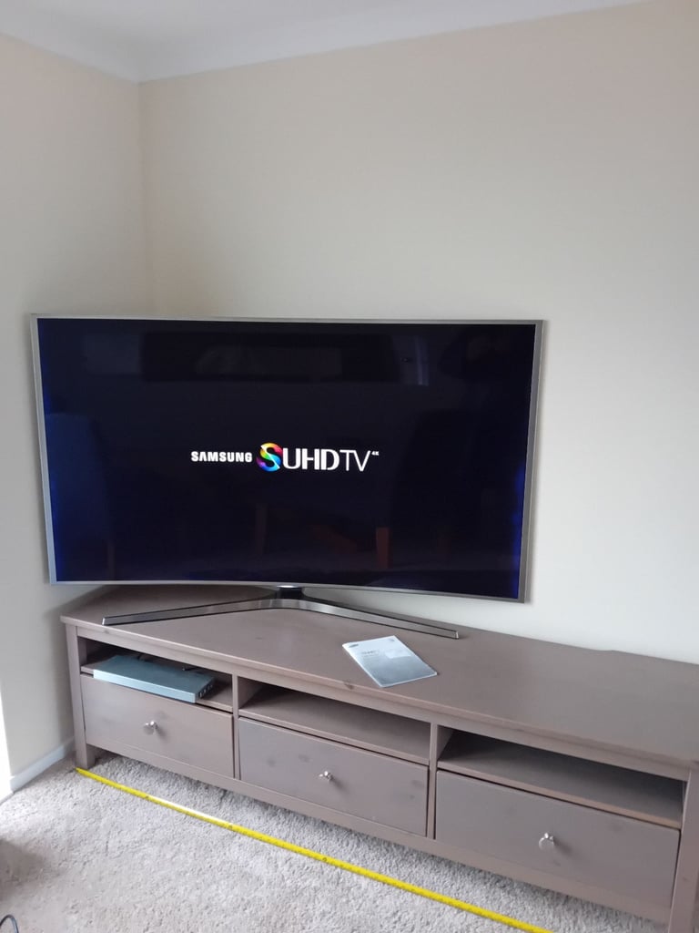 image for 65.inch curved samsung tv. And tv bench.