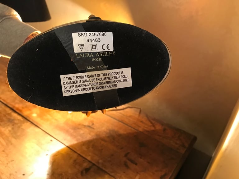 Pair of Laura Ashley side lamps gold with black shades. 