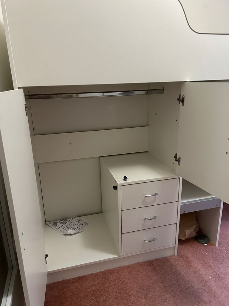 Cabin bed with built-in wardrobe and workstation. 