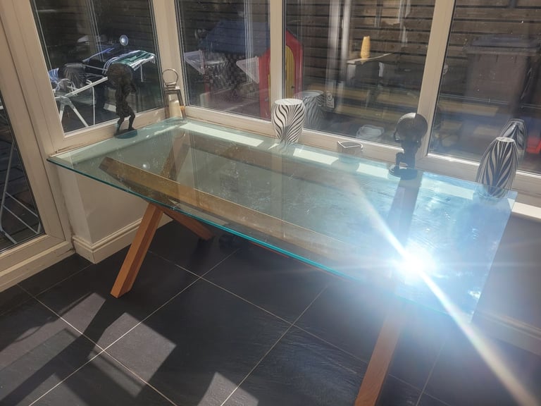 image for Glass dining table with wooden frame