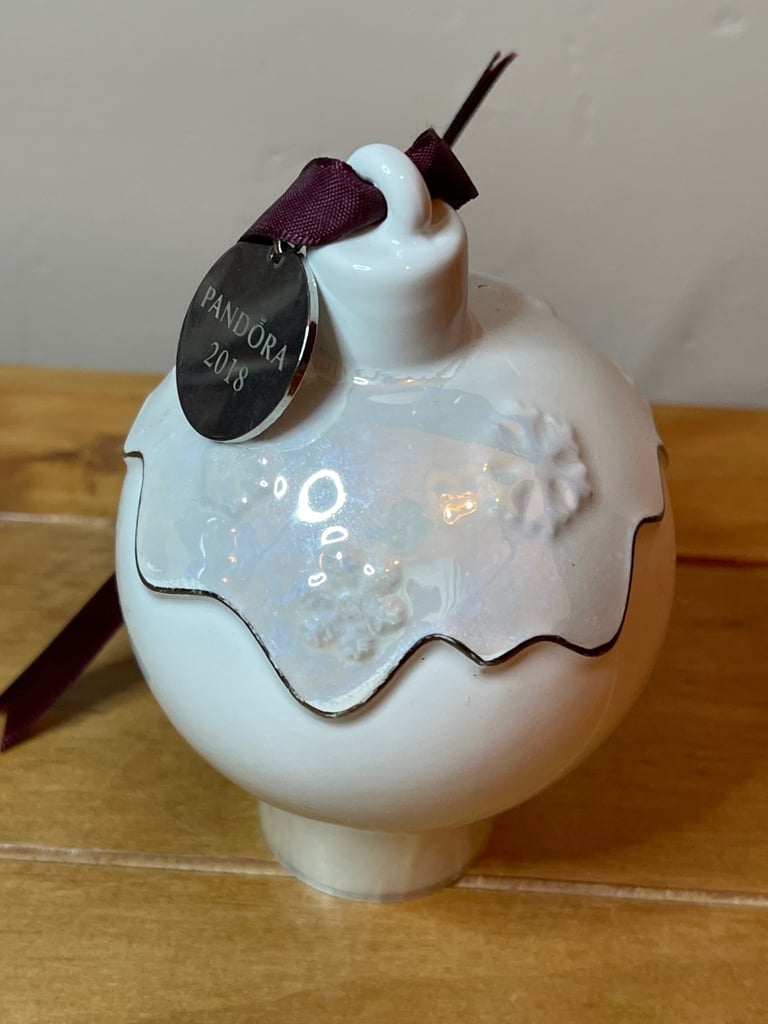 Pandora 2018 Ceramic Christmas pud bauble 2018 with purple ribbon and snowflake detail.
