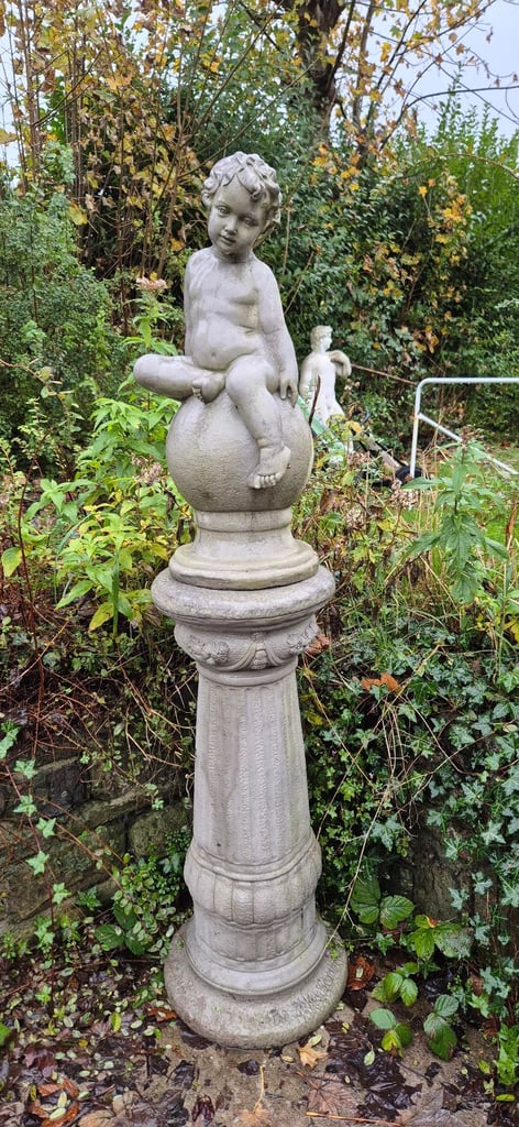 image for Large concrete cherub on plinth garden statue