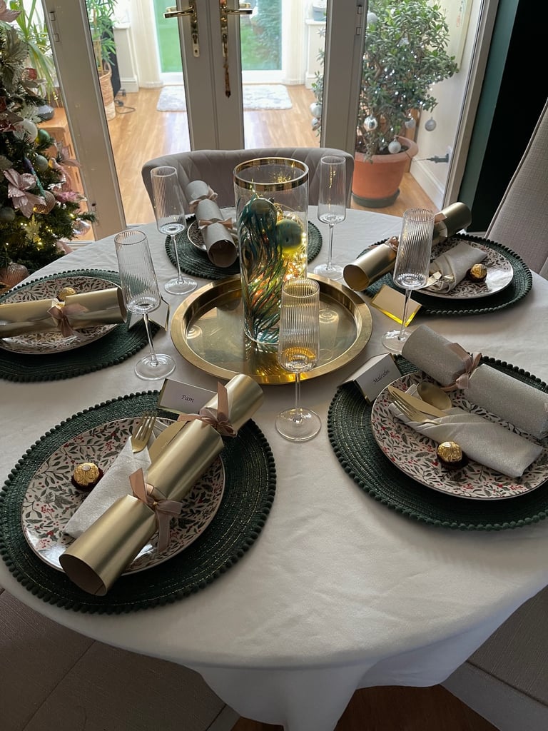 Oak and glass dining table and four chairs