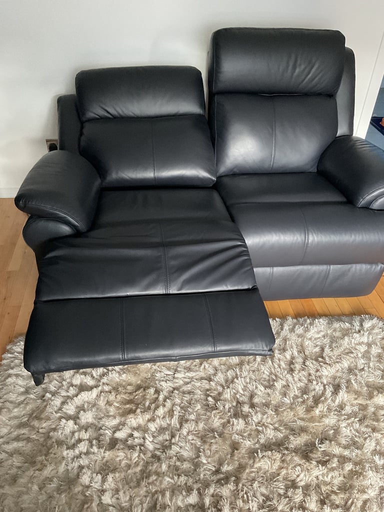 REDUCED PRICE    NEW 2 x 2 seater leather sofas 1 of which is a power recliner