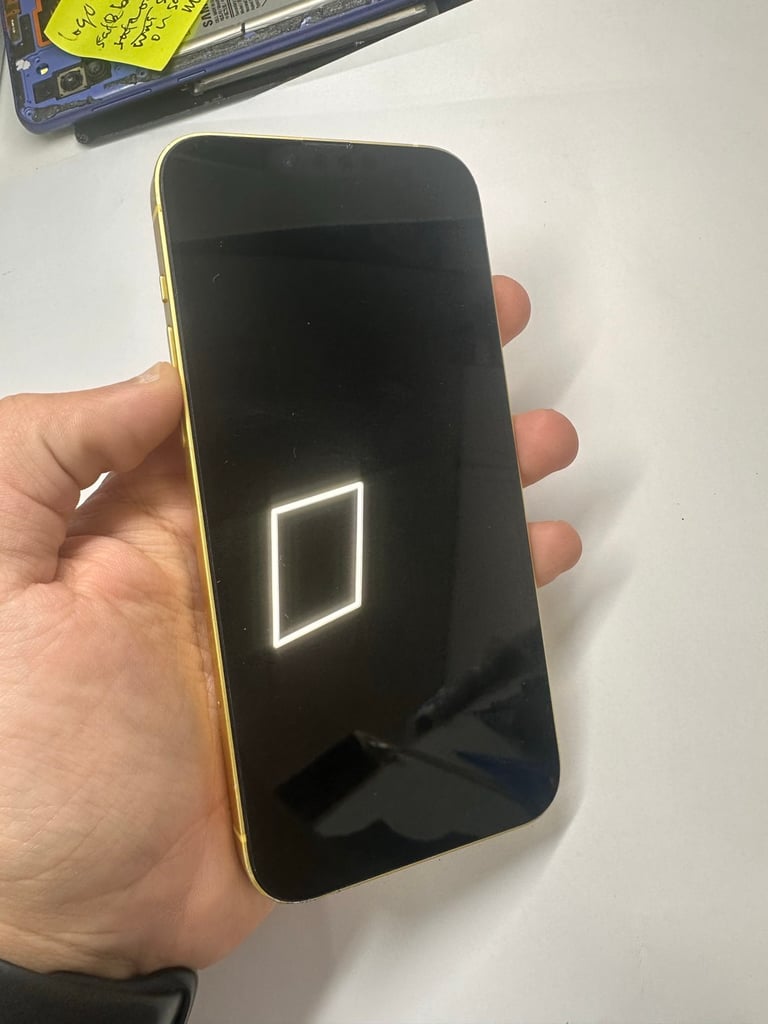 Yellow iPhone 14 Plus in good condition at phone shop 