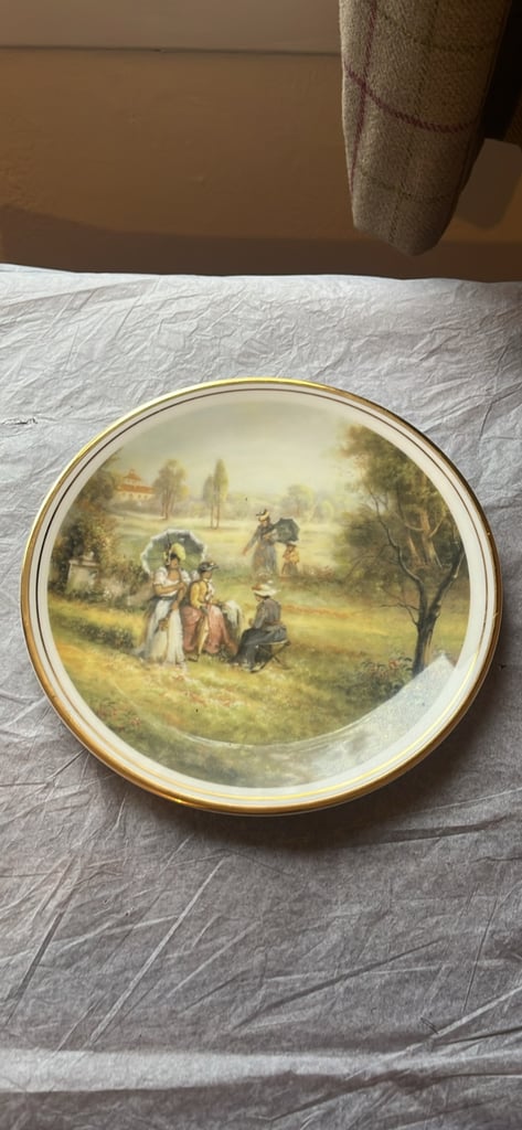 image for This is a collector's plate titled "Sunday in the Park" by C. Pila