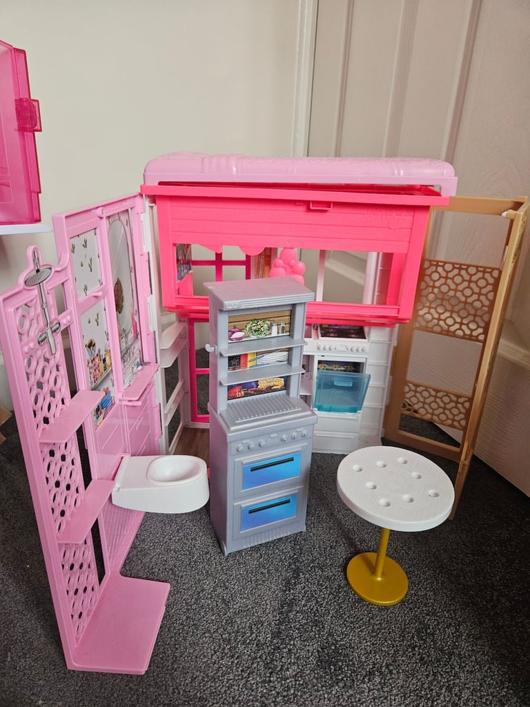 Barbie dreamhouse and barbie bundle