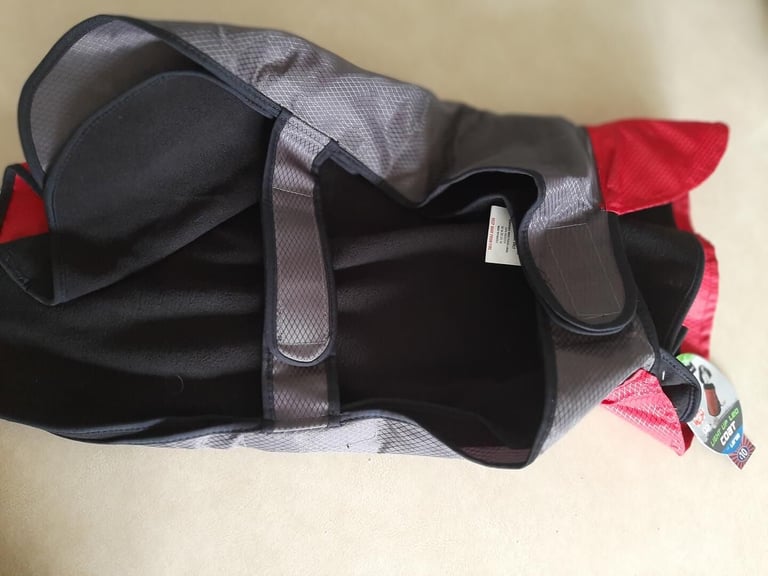 Dog coat water resistant. with removable fleece lining. coat lights up. new  size large.