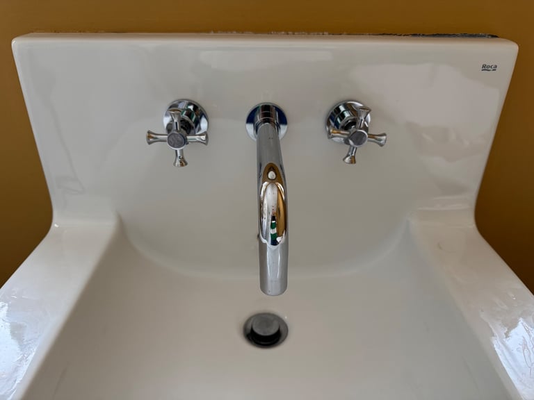 Roca wall mounted sink with back splash