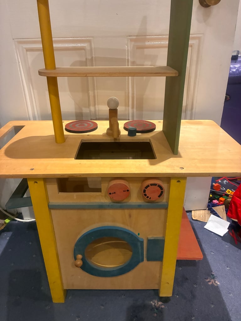 Lovely quality wooden toy play kitchen two sided to include cooker and washing machine used