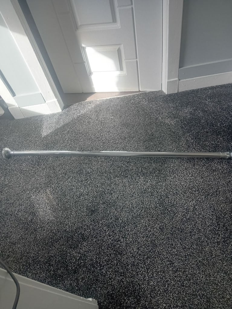 Silver extendable curtain pole