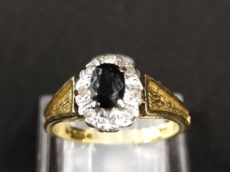 18ct Sapphire Ladies Ring surrounded by White Diamonds Size N Weight 5.02g. 