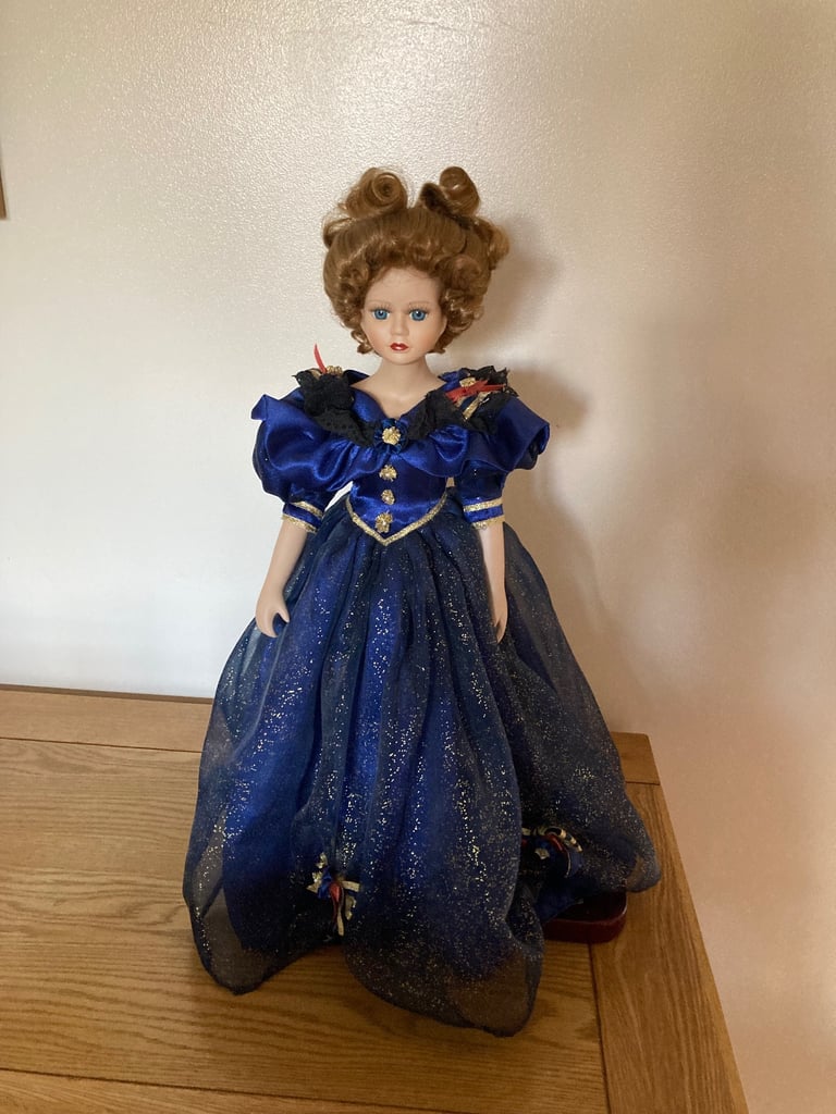 image for Vintage porcelain doll with stand 