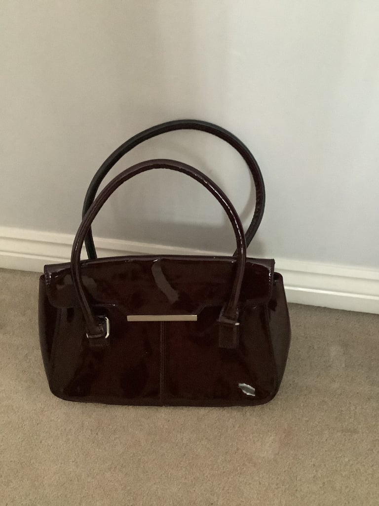 Burgundy patent effect handbag