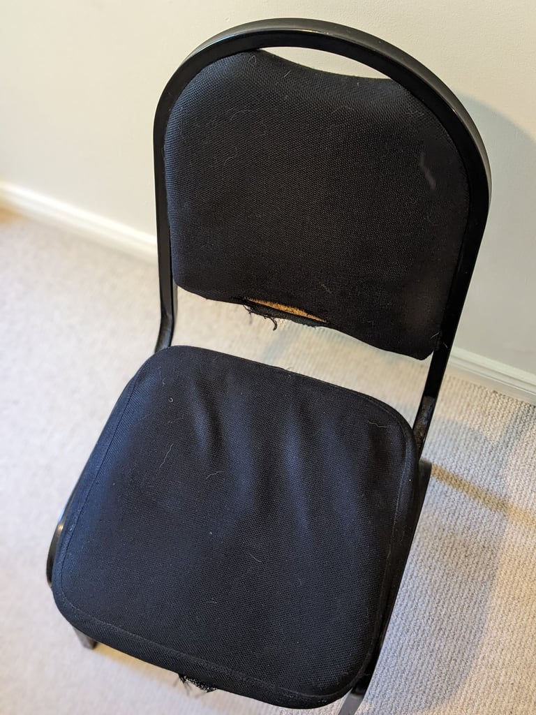 Four black office chairs - stackable 