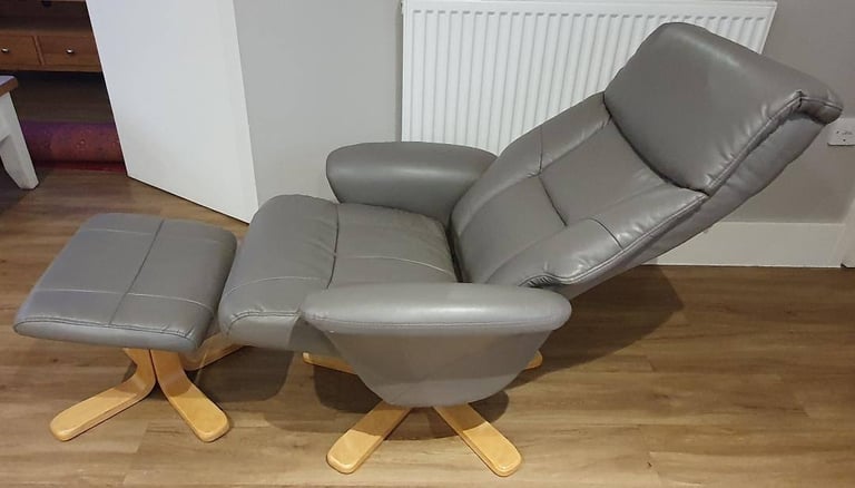 Faux grey leather swivel recliner chair and footstool