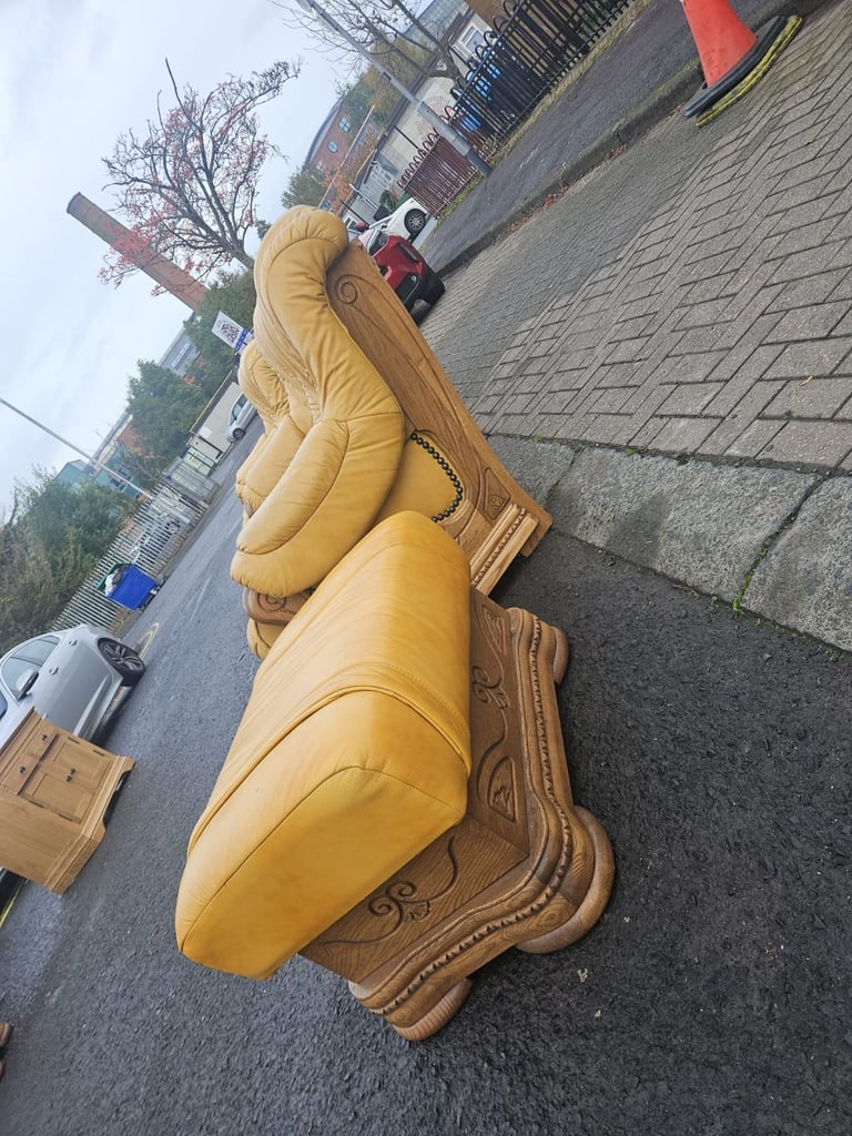 Leather sofa in soild oak inset with matching footstool 