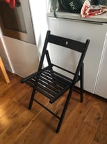 Black fold up IKEA chairs 