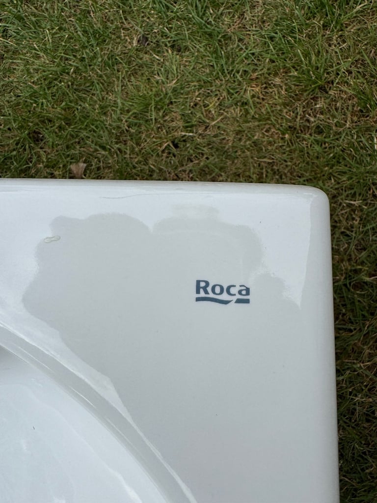 Roca brand white ceramic wall hanging cloakroom sink.  