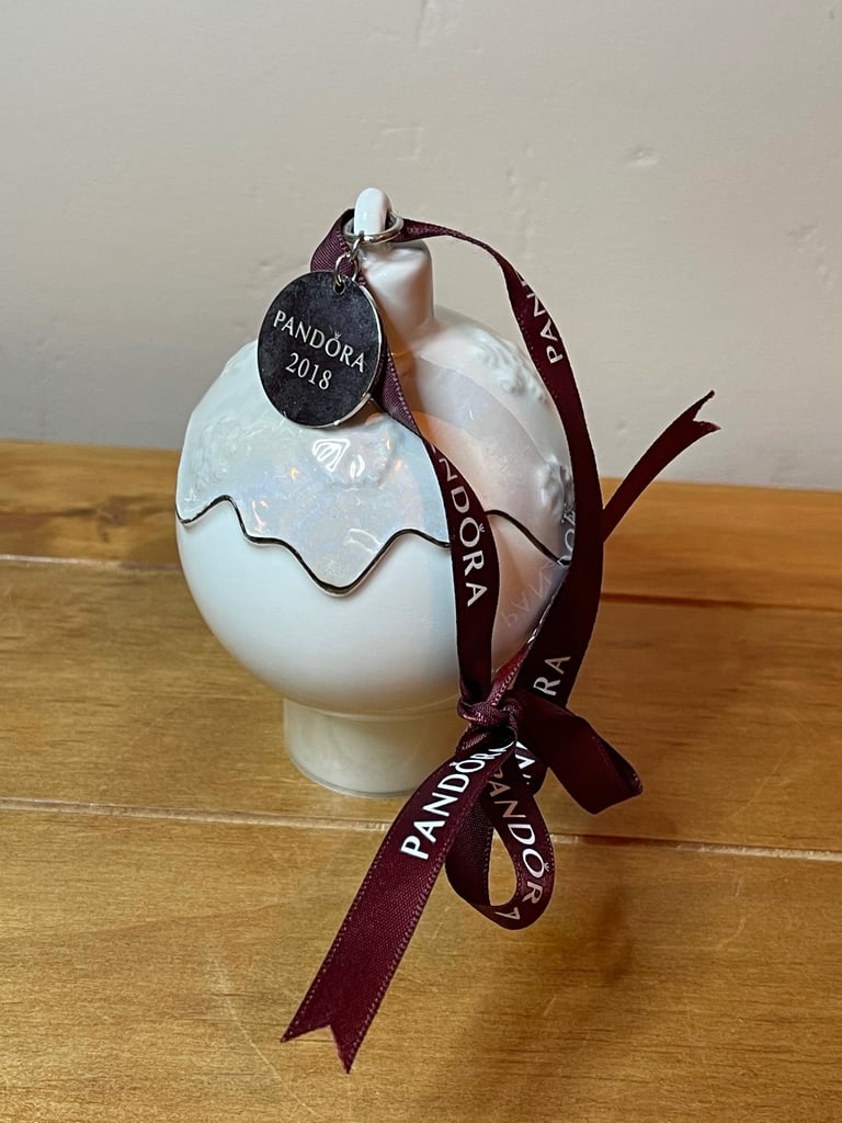 Pandora 2018 Ceramic Christmas pud bauble 2018 with purple ribbon and snowflake detail.