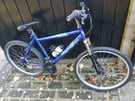 Townsend blue mountain front suspension mountain bike. 