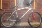 Apollo XC26 Mountain Bike with Front Suspension 21 speed Shimano gears 26 inch alloy wheels 