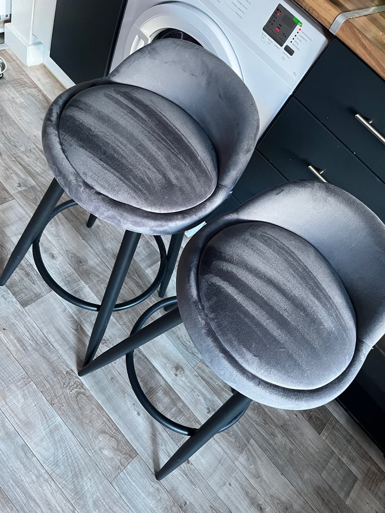 Two soft grey bar stools