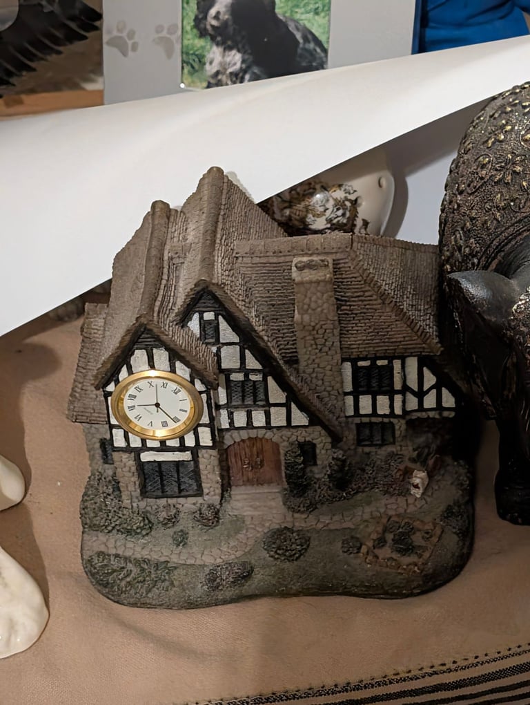 Border fine arts cottage with clock