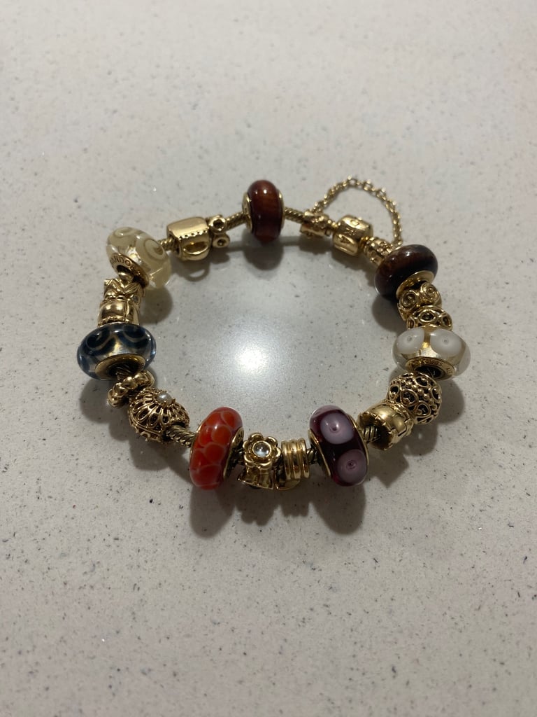 Pandora 14ct Gold Bracelet & 14ct Gold Charms.