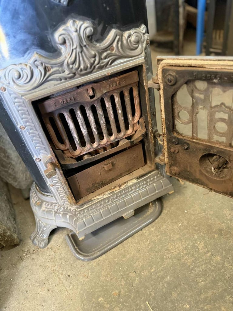 Secondhand Cast Iron Wood / Coal Burning Stove