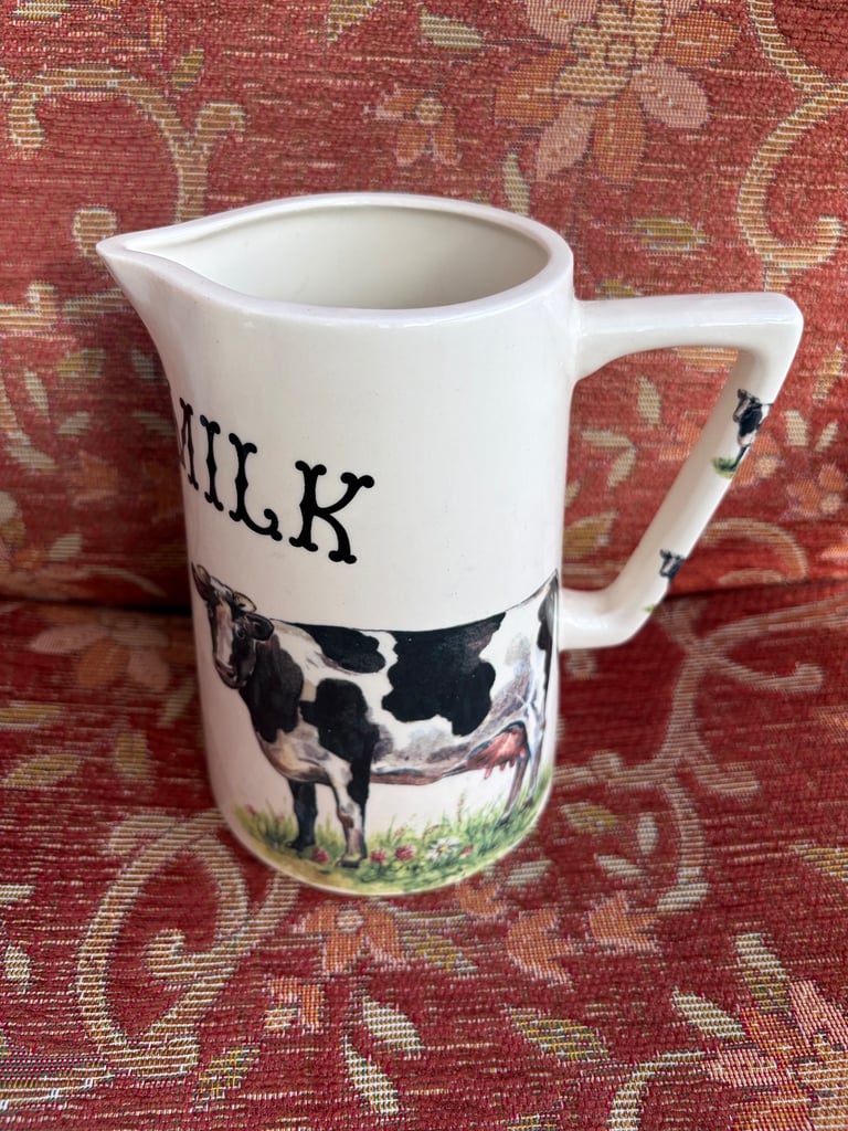 Ceramic milk jug with cow illustration