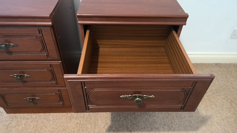 A matching pair of bedside cabinets with 3 drawers in each