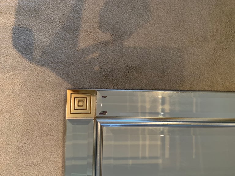 Large frameless mirror with corner detailing