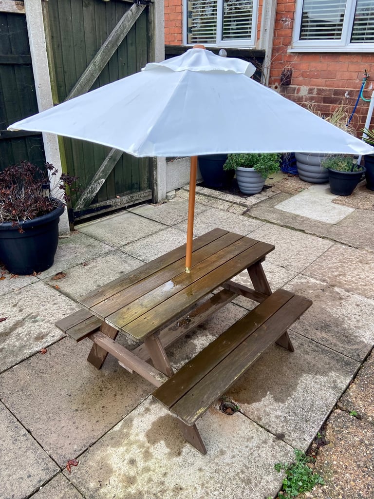 Children’s wooden picnic bench with parasol