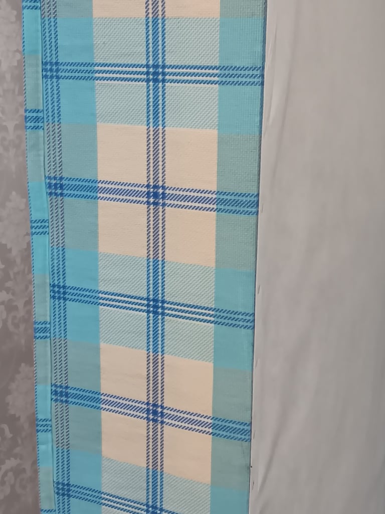 Single bed base and mattress with additional guest mattress stored underneath 