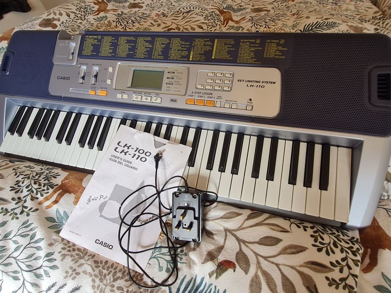 image for Casio L110 Keyboard with lit up Key Lighting System & Power Adapter