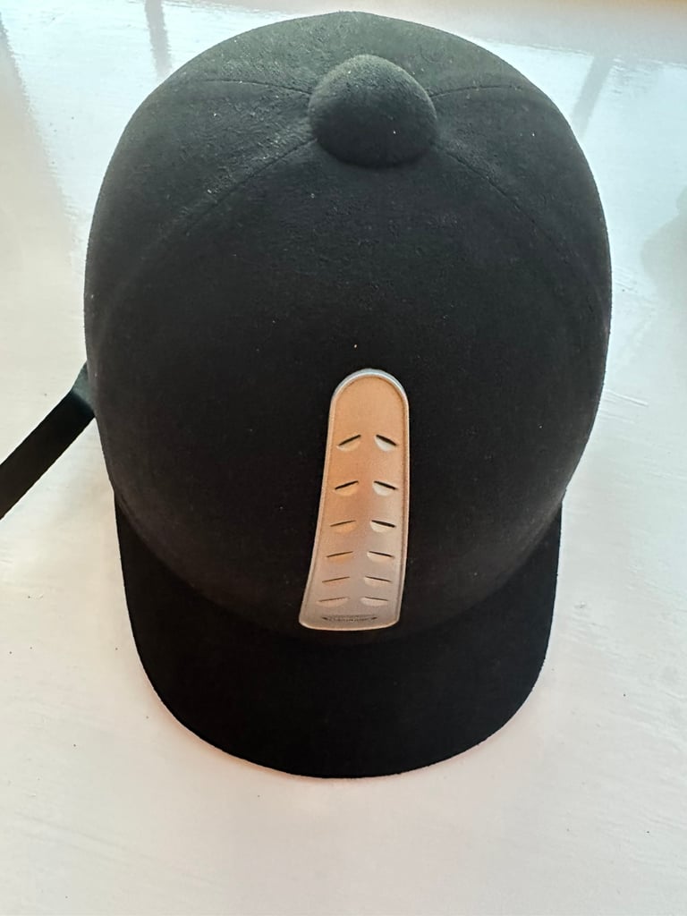 Three horse riding hats