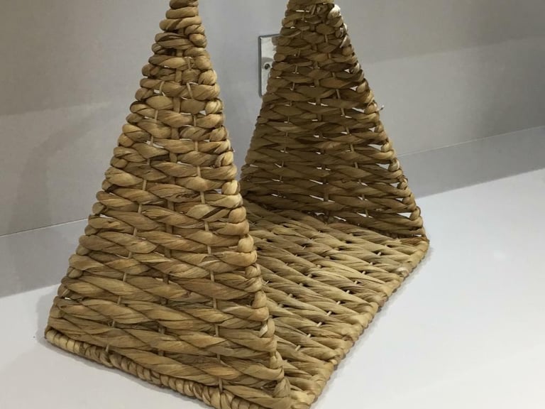 floor standing sea grass basket used for putting throws in neatly 