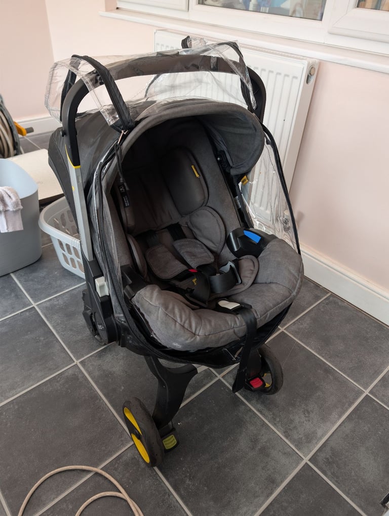 image for Doona + car seat stroller with rain cover and inserts 