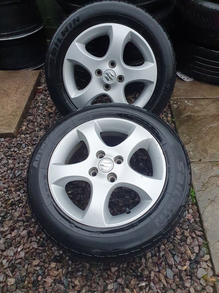 15"SUZUKI SWIFT ALLOY WHEELS x2 in very good condition including tires with tread of 7mm.