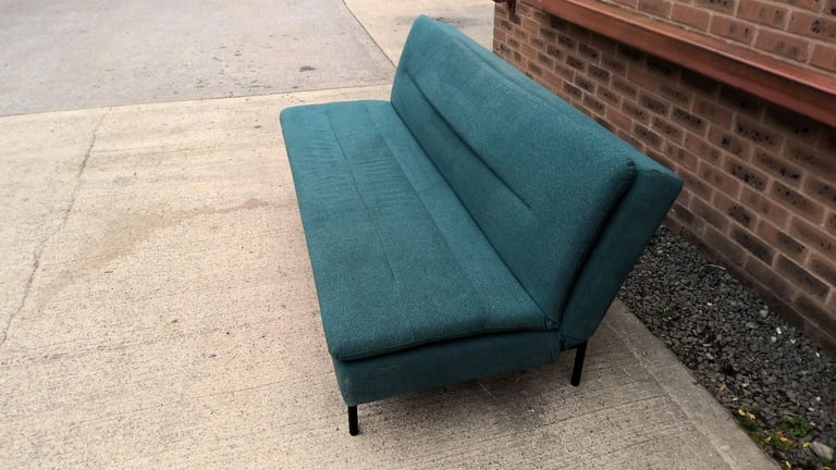 green 2 seater sofa that folds down to be a sofa bed 