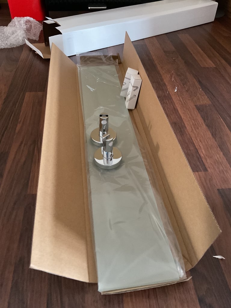 Tissoni designer bathroom vanity glass and chrome shelves.